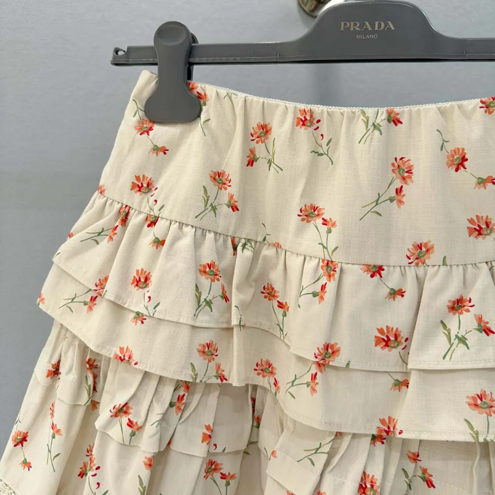 Side angle showing silhouette and zipper detail of Prada linen miniskirt