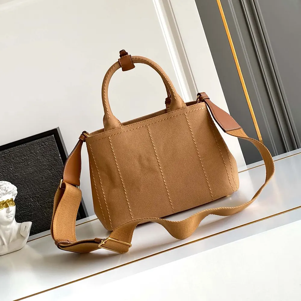 Side profile showing compact silhouette of Prada Women Jardinière Small Cotton Canvas Handbag-Brown
