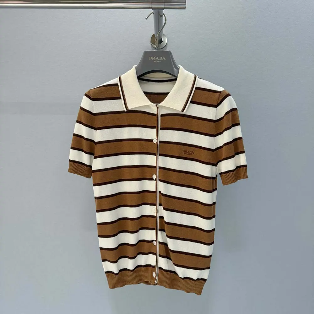 Side angle showing fitted silhouette of Prada striped cardigan
