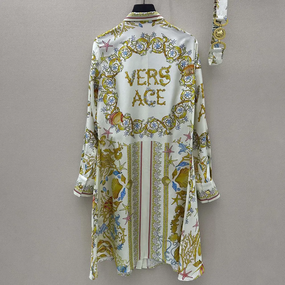 Side angle of flowing silk fabric on Versace Women Underwater Barocco dress