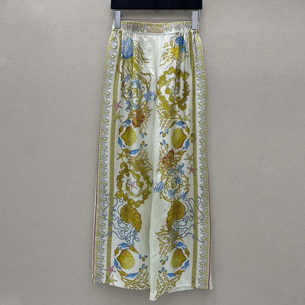 Close-up of Barocco print on Versace Women Underwater Barocco Silk Pants-Yellow
