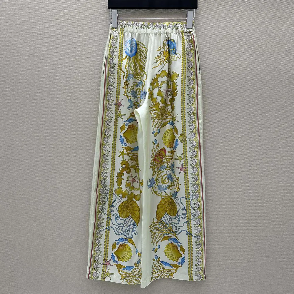 Detail of silk fabric and waistband on Versace Women Underwater Barocco Silk Pants-Yellow