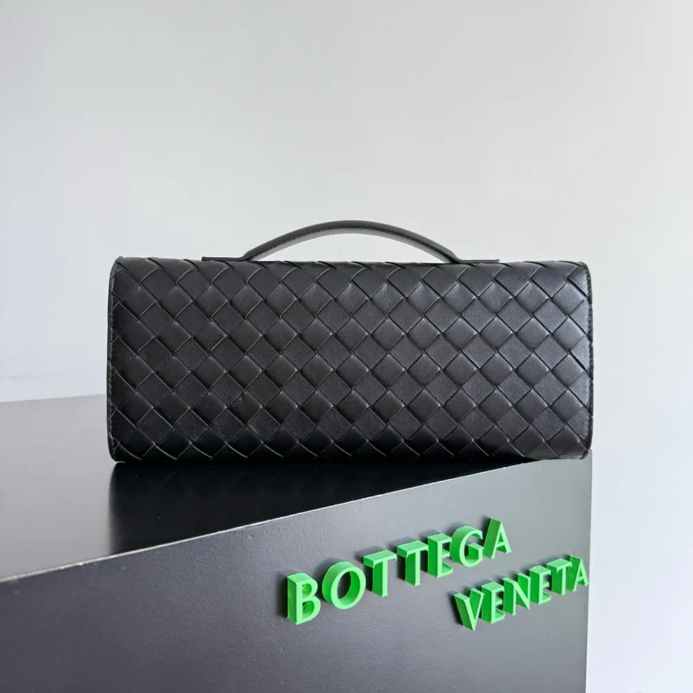 Side angle of sleek silhouette on Bottega Veneta Women Andiamo Clutch