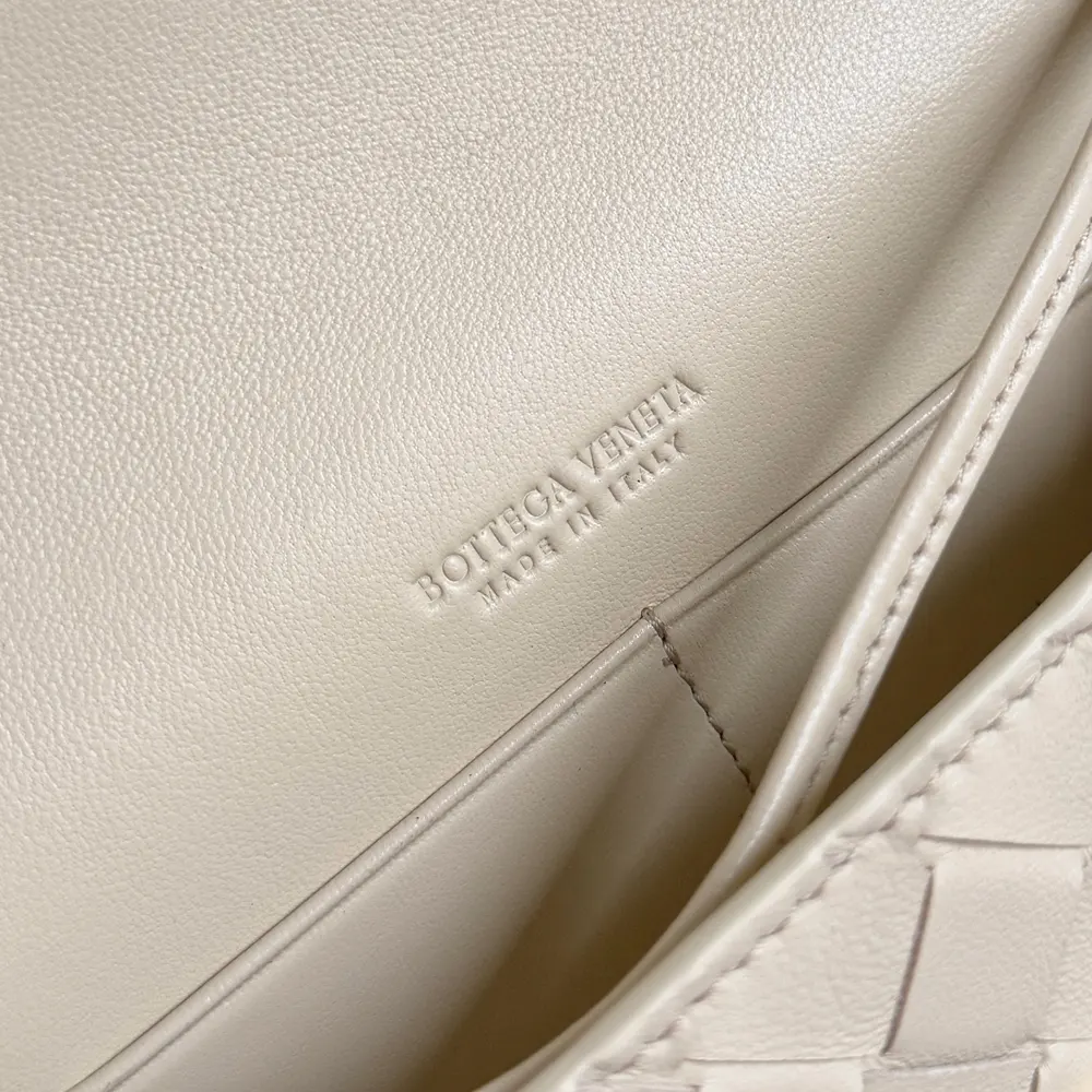 Close-up of intrecciato woven leather detail on Bottega Veneta Women Andiamo Pouch-White