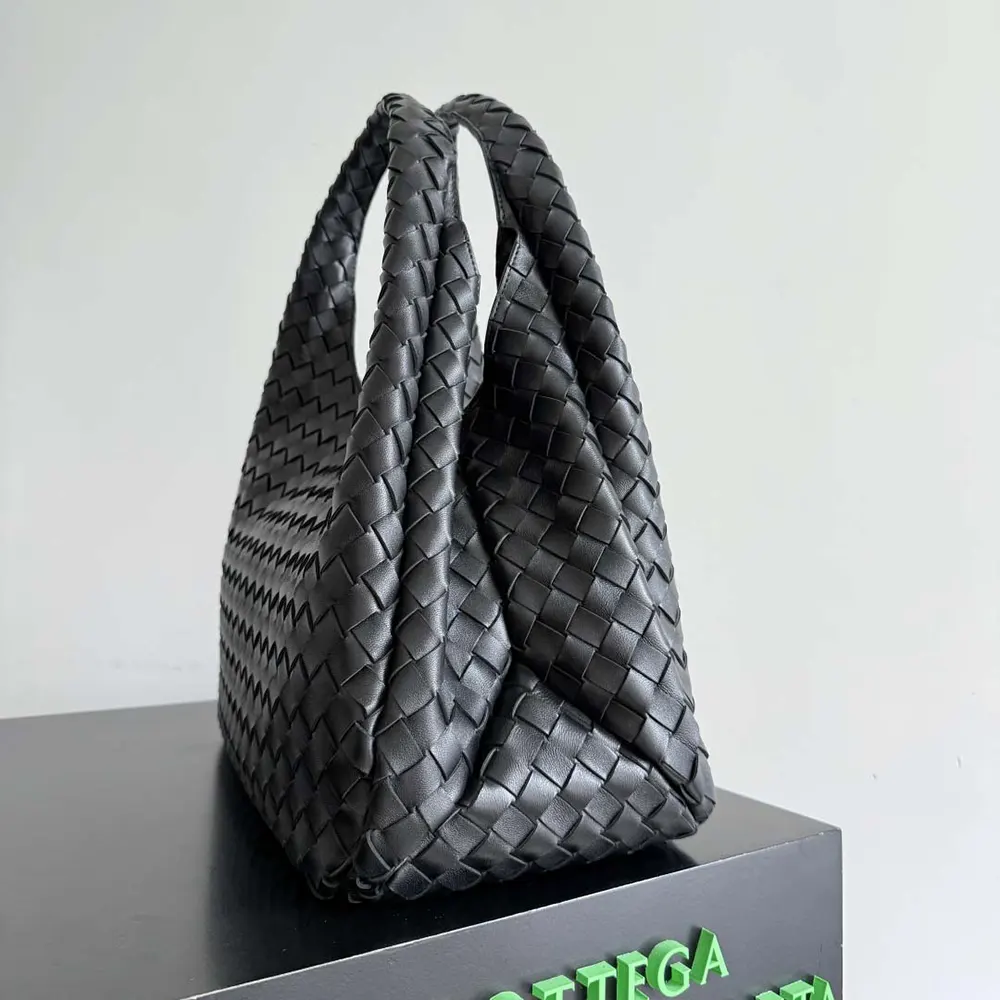 Side angle showing silver-tone hardware on Bottega Veneta bag