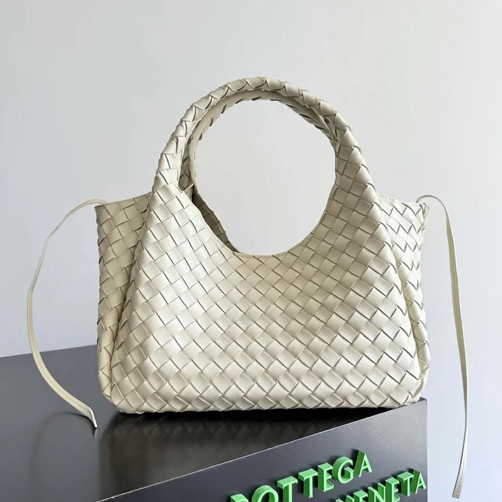 Side angle showing silhouette and strap detail of Campana-White bag