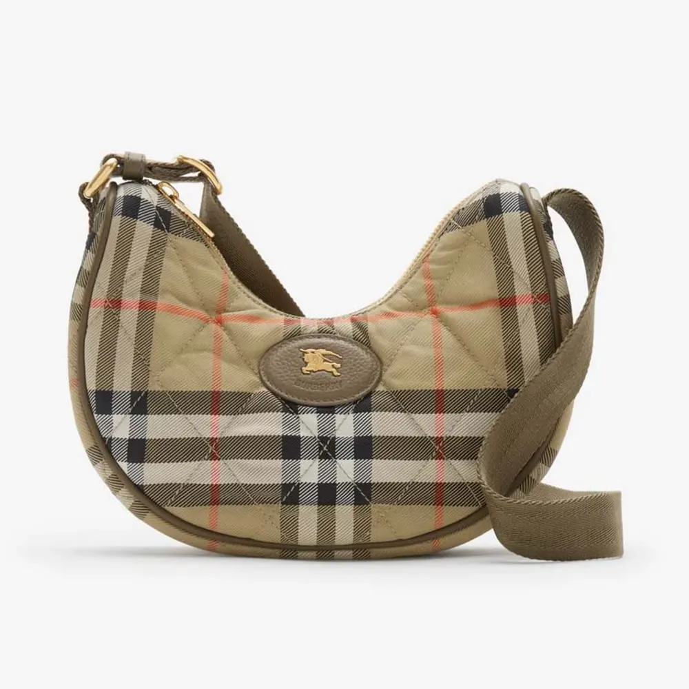 Front angle of Burberry Women Horseshoe Crossbody Bag showing horseshoe flap