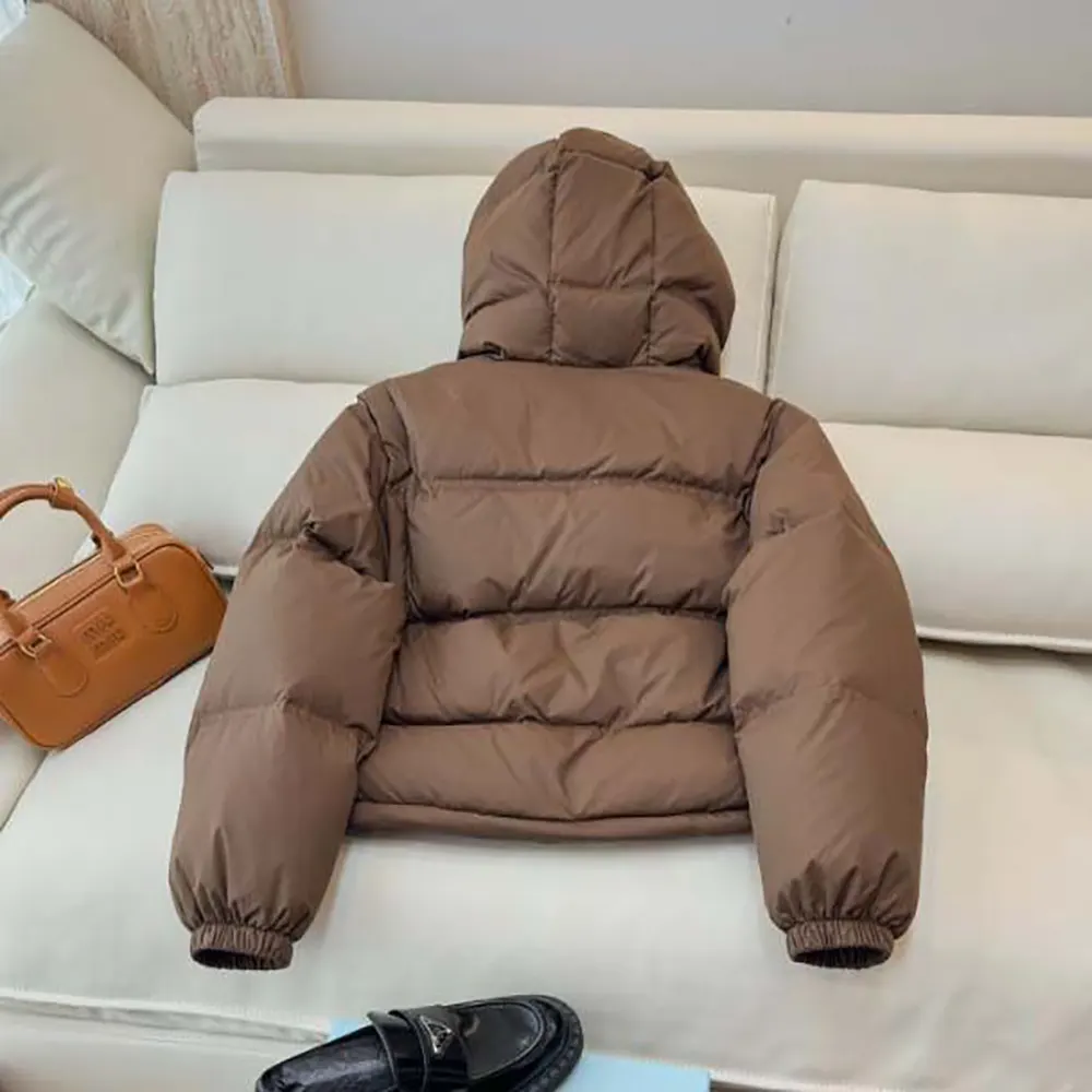 Side profile showing silhouette of Celine Women Triomphe Cropped Down Jacket