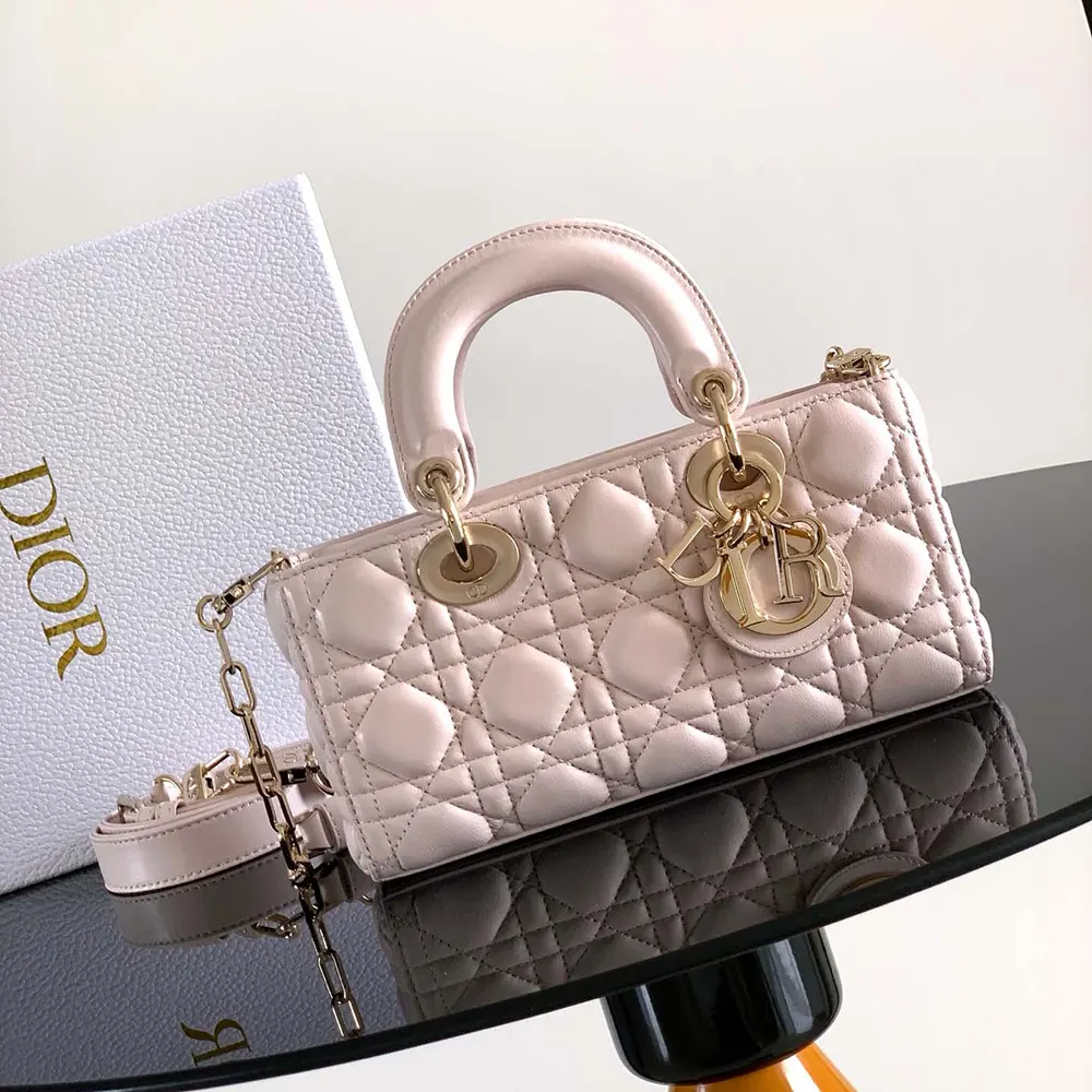 Close-up of silver-tone Dior CD clasp on Small Lady D-Joy Bag