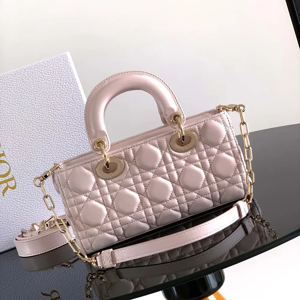 Side view showcasing Cannage quilting on powder pink Lady D-Joy Bag