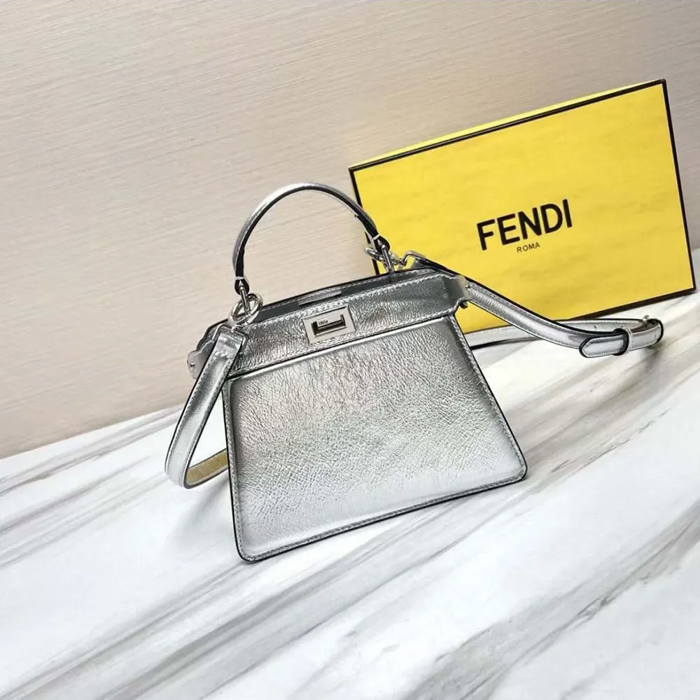 Close-up of silver twist-lock hardware on Fendi Peekaboo ISeeU Petite Mini