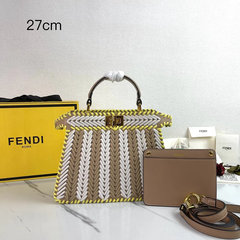 Close-up of yellow interlaced leather and gold clasp on Fendi Women Peekaboo ISeeU Small bag