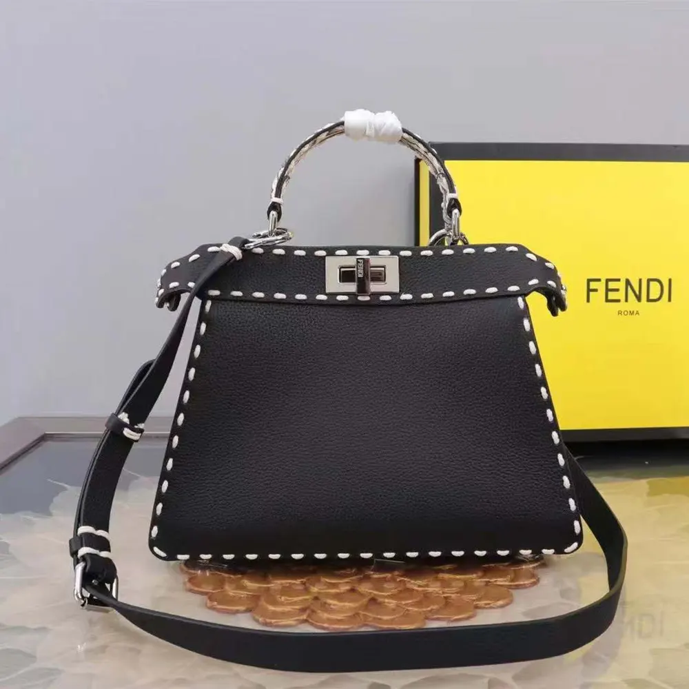 Close-up of gold-tone hardware on Fendi Women Peekaboo Iseeu Small Black Selleria Bag
