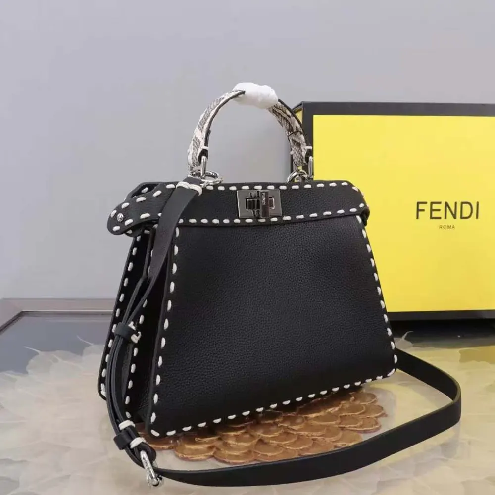 Side view showing silhouette and leather texture of Fendi Women Peekaboo Iseeu Small Black Selleria Bag