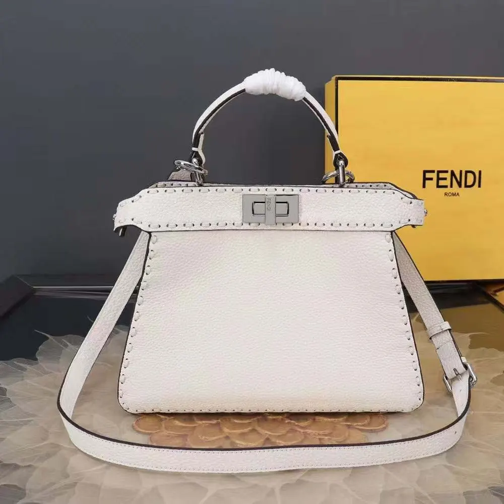 Close-up on gold hardware and hand-stitched details on Fendi bag
