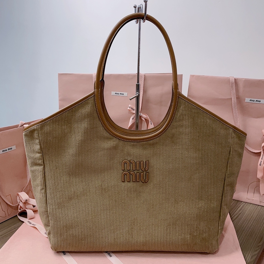 Close-up of silver hardware on Miu Miu Women IVY Corduroy Shopping Bag