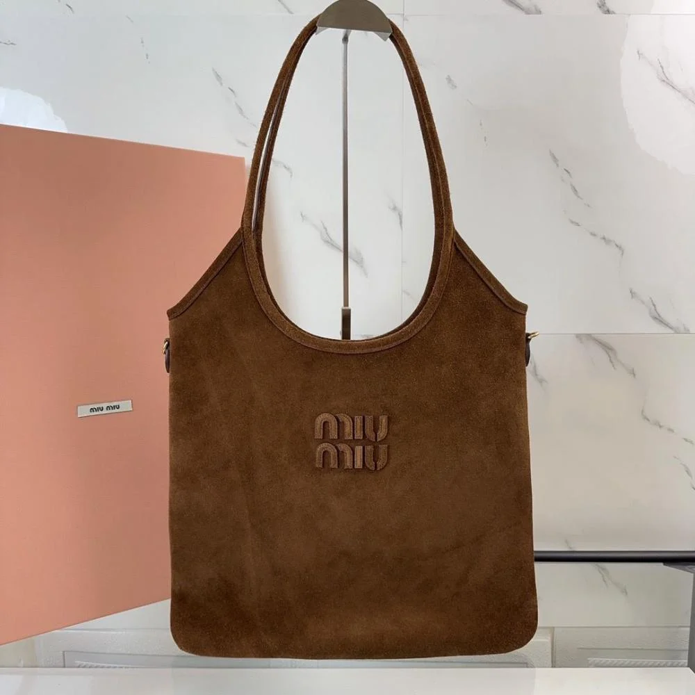 Close-up on gold-tone hardware detail of Miu Miu Women Ivy Suede Bag-Dark Brown