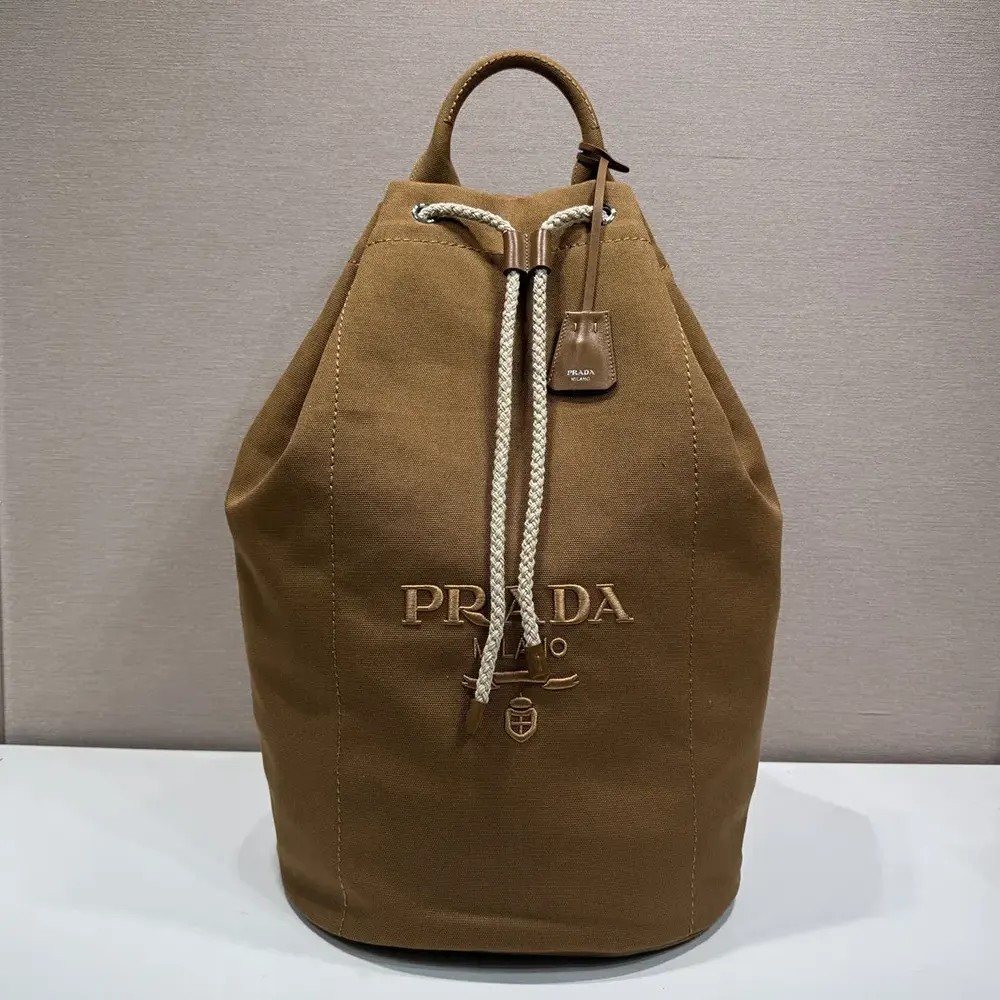 Side angle showing spacious interior of Prada Canvas Duffle Bag