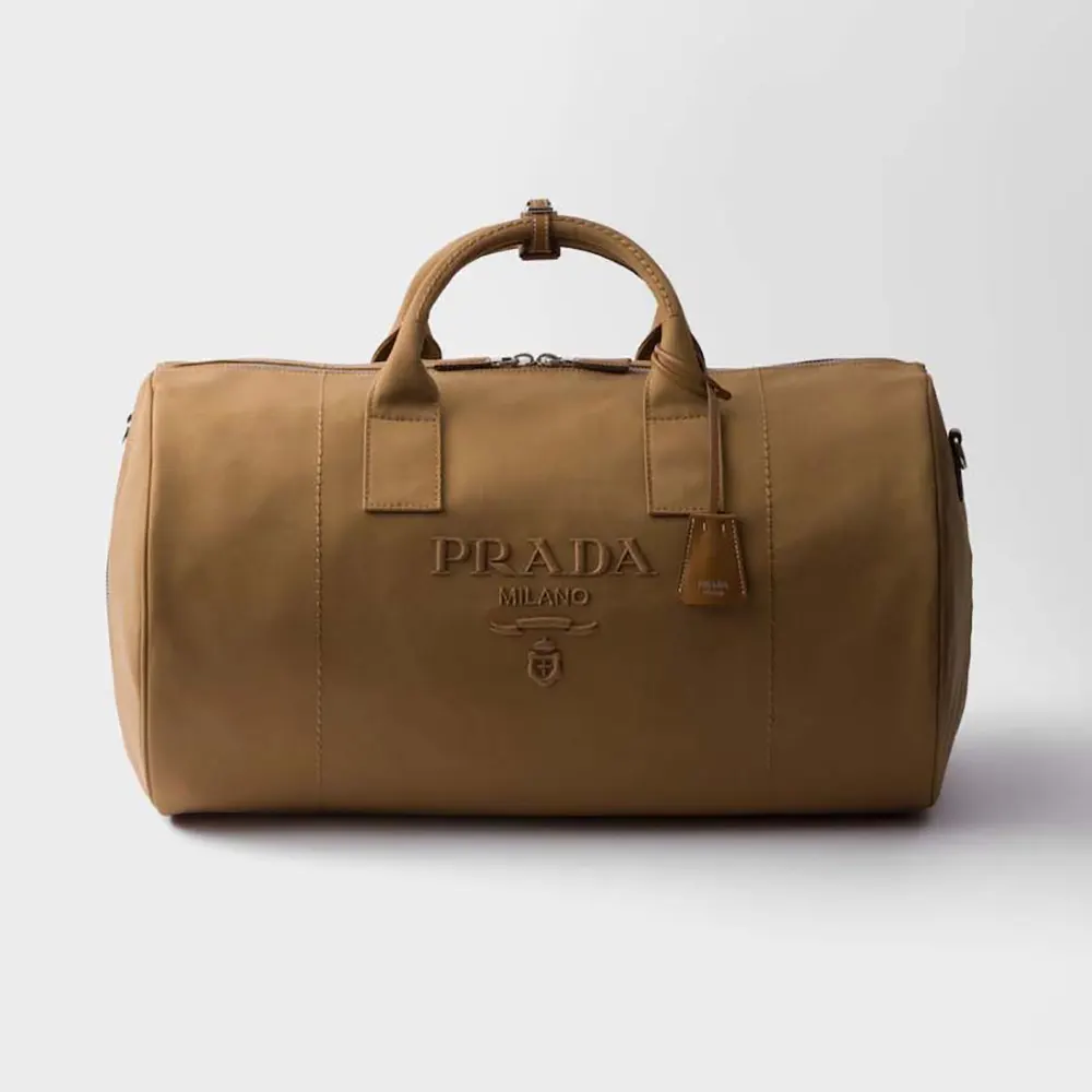 Front angle of Prada Unisex Canvas Duffle Bag-Brown showing leather trim