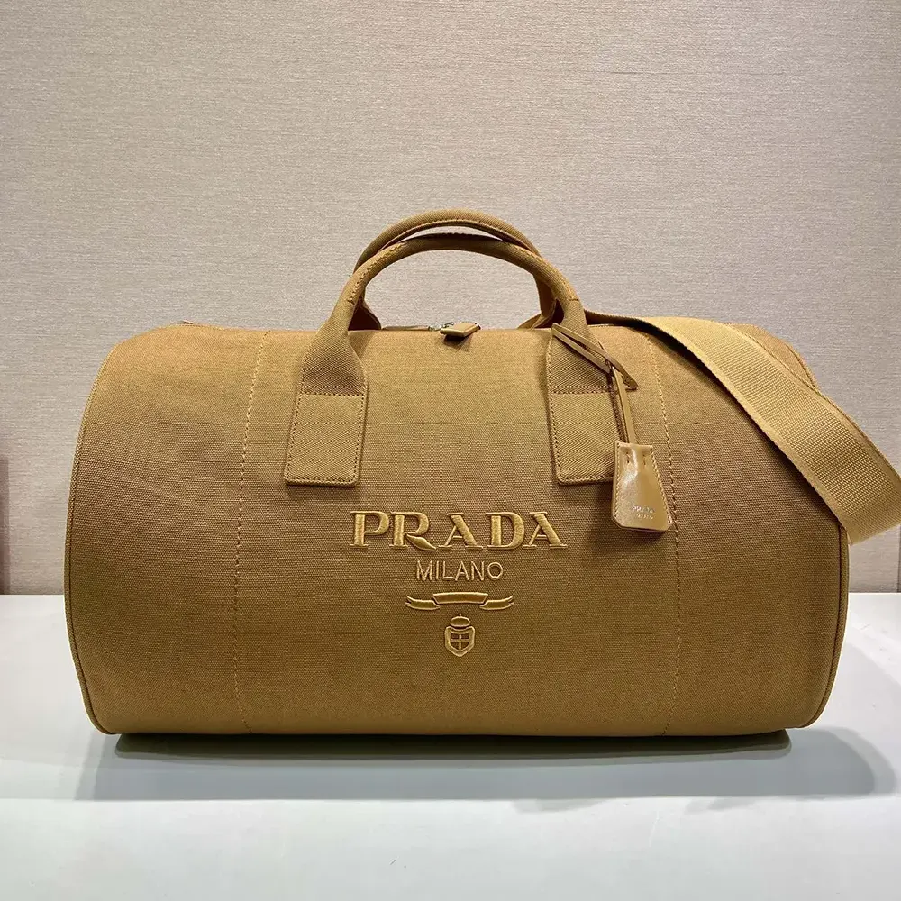 Close-up of brushed silver hardware on Prada Unisex Canvas Duffle Bag-Brown