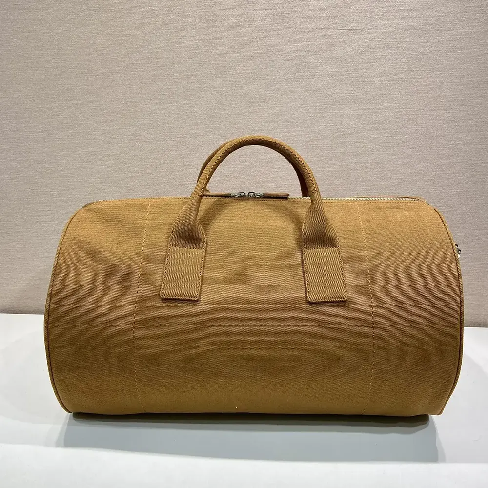 Side profile of Prada Unisex Canvas Duffle Bag-Brown with shoulder strap visible