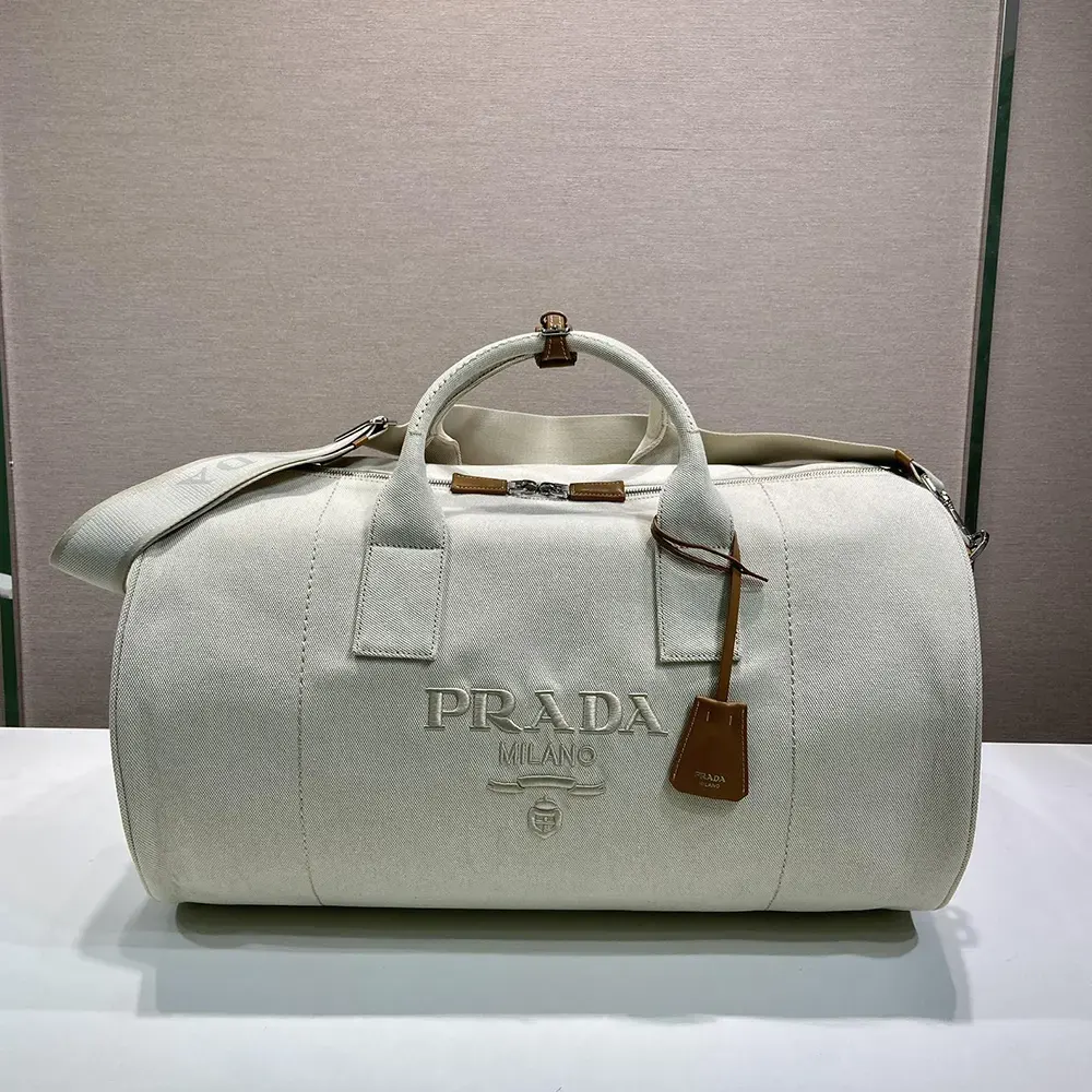 Close-up of silver hardware on Prada Unisex Canvas Duffle Bag-White