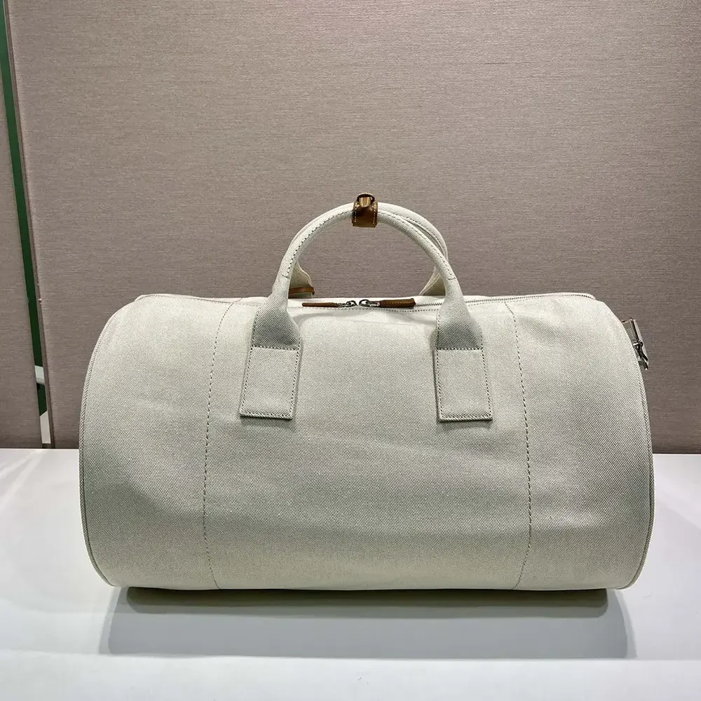 Side angle showing spacious interior of Prada Unisex Canvas Duffle Bag-White