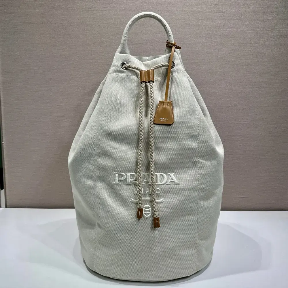 Close-up detail of drawstring and silver-tone hardware on Prada bag