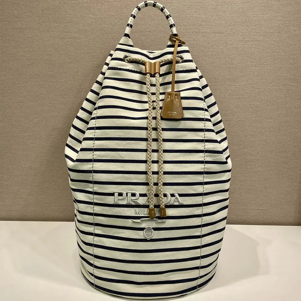 Close-up of drawstring closure on Prada Unisex Striped Canvas Duffel Bag