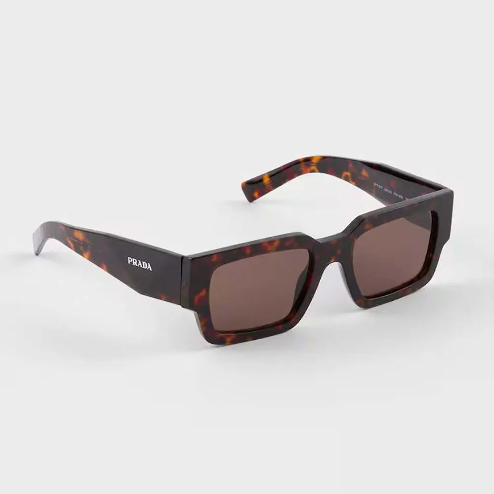 Close-up of silver Prada logo hardware on sunglasses temple
