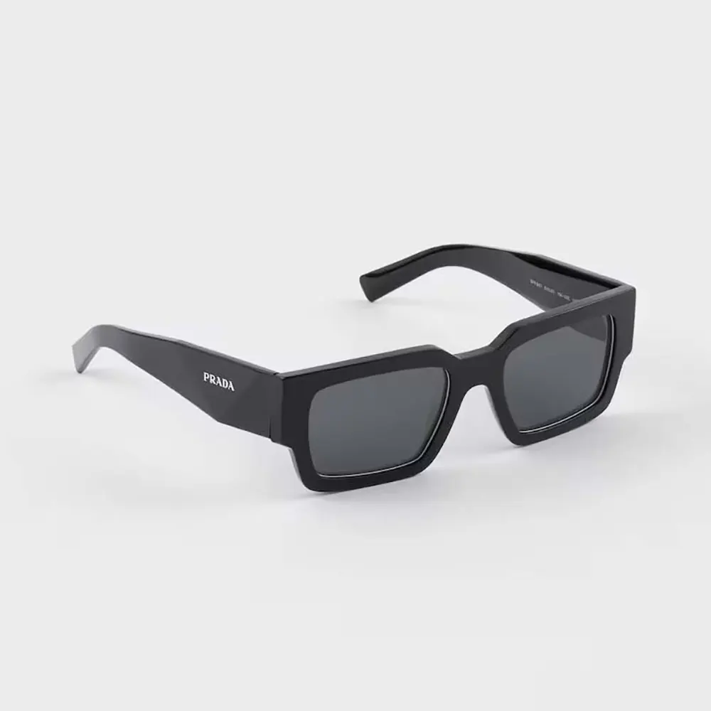 Close-up of metallic Prada logo detail on sunglasses temple