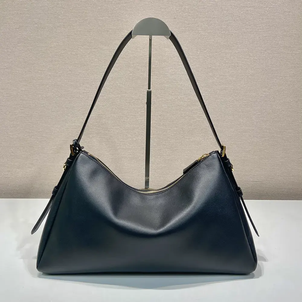 Side angle showing magnetic flap closure of Prada Women Aimée bag