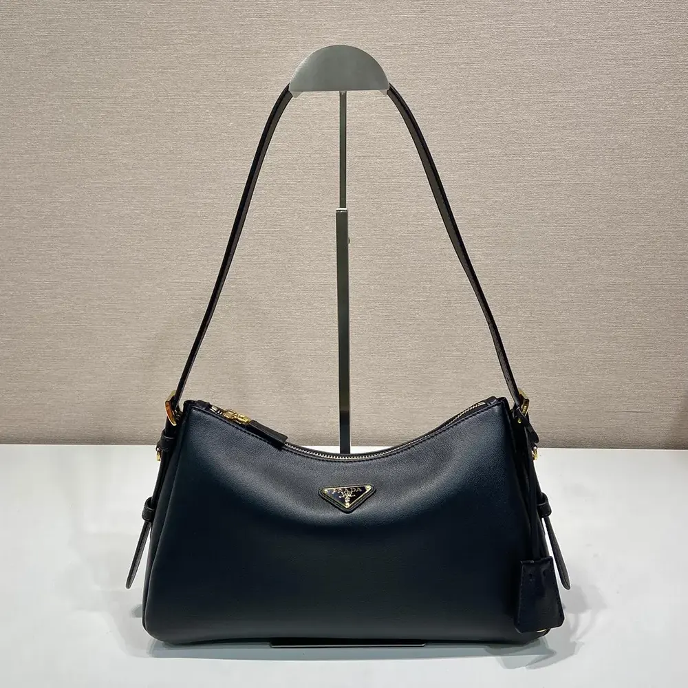 Close-up of silver Prada logo on Aimée Medium Leather Shoulder Bag-Black