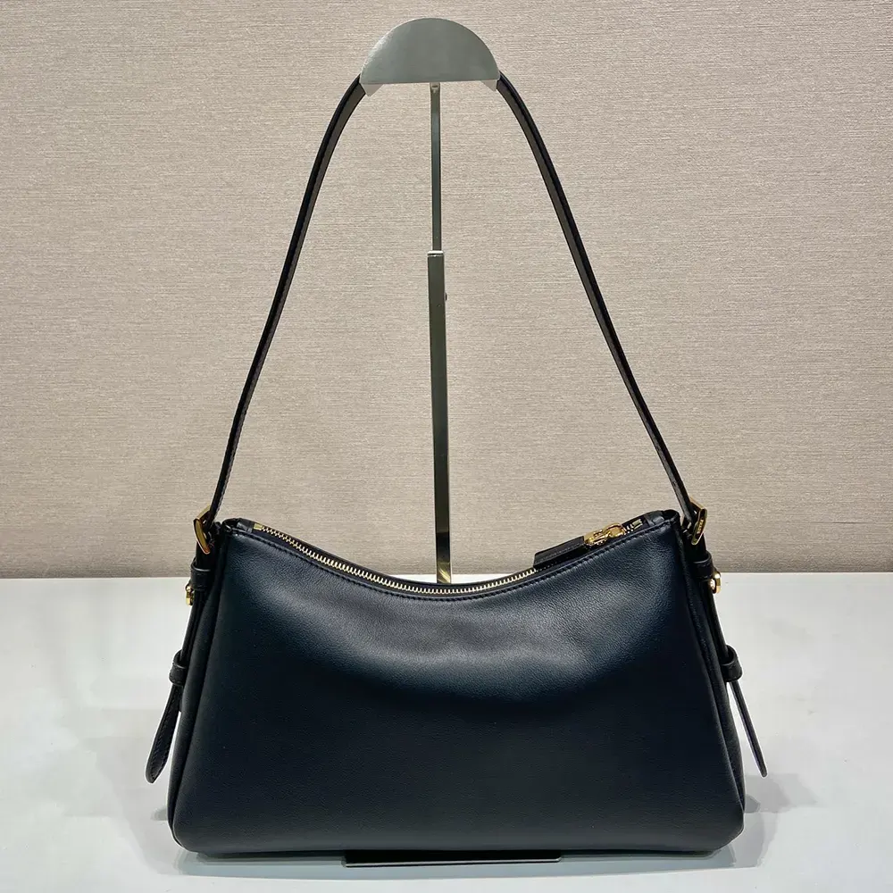 Side angle showing smooth leather texture of Prada Women Aimée Shoulder Bag