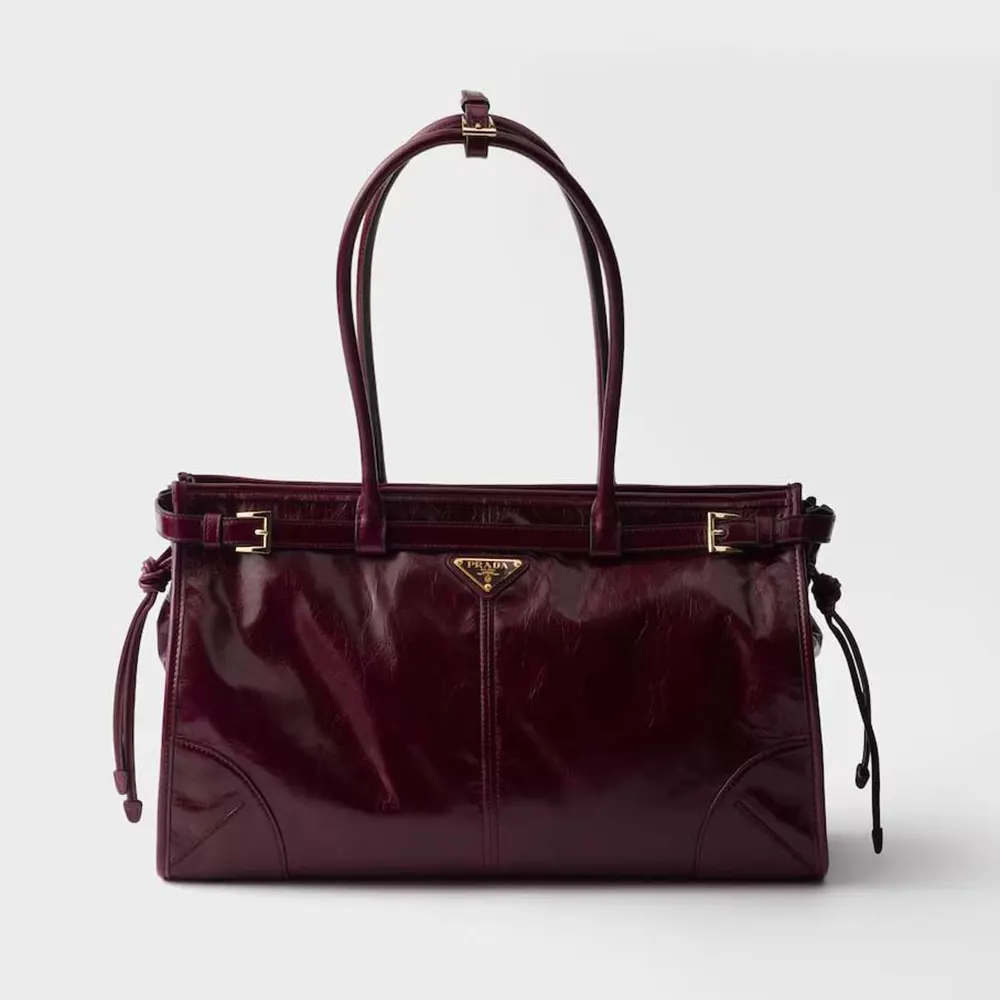 Front view of Prada Women Bonnie Medium Leather Handbag-Maroon highlighting flap closure