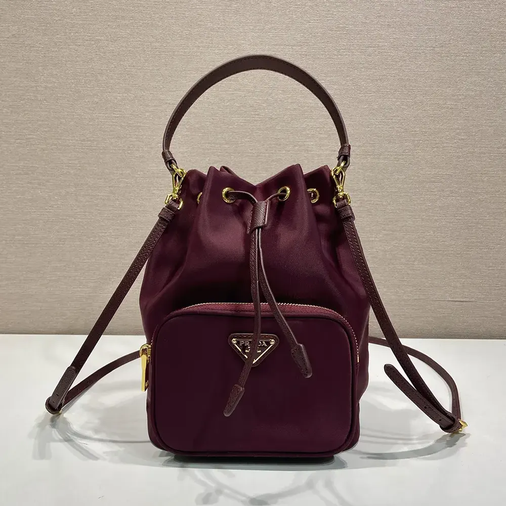 Close-up of silver hardware detail on Prada Women Duet Re-Nylon Bucket Bag-Maroon