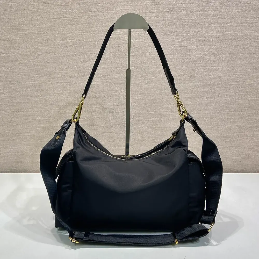 Side profile showing texture of Prada Women Explore Large Re-Nylon And Leather Bag-Black