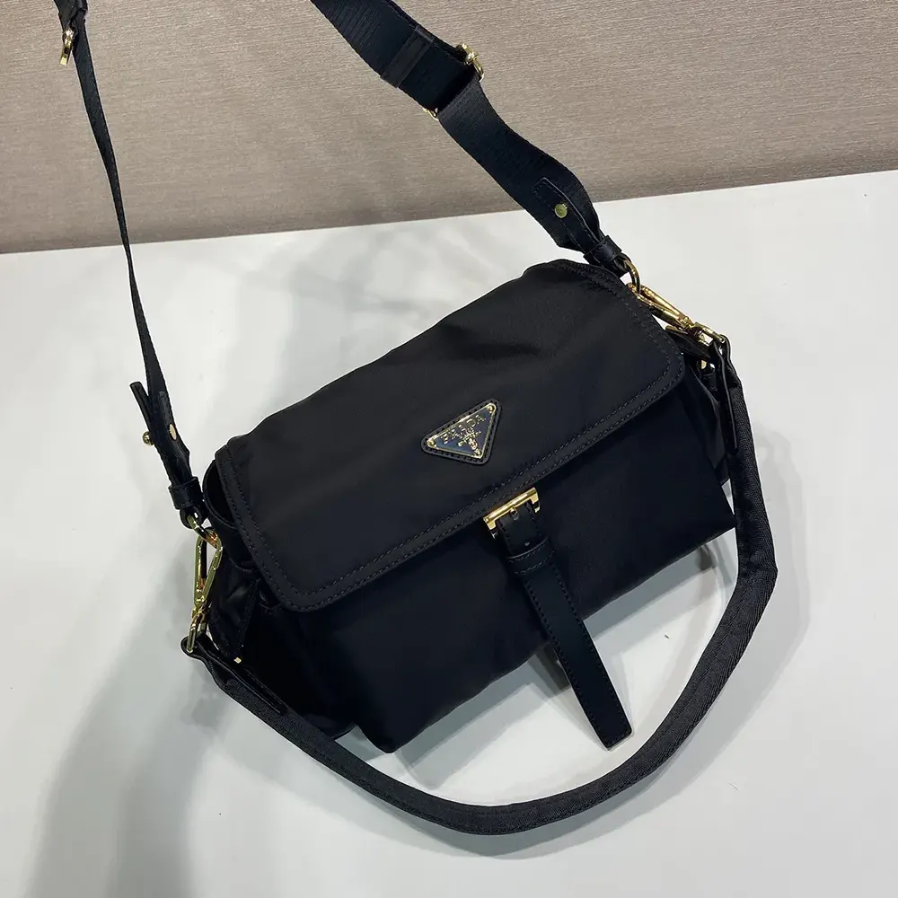 Side view showing silhouette of Prada Women Explore Large Re-Nylon Shoulder Bag With Flap-Black