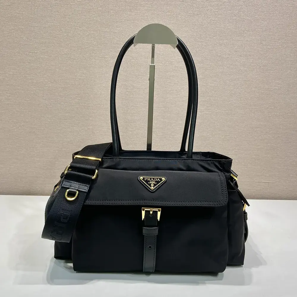 Close-up of black leather and silver hardware on Prada Women Explore Medium Tote