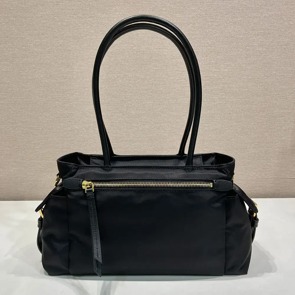 Side profile showing silhouette of Prada Women Explore Medium Re-Nylon And Leather Tote Bag-Black