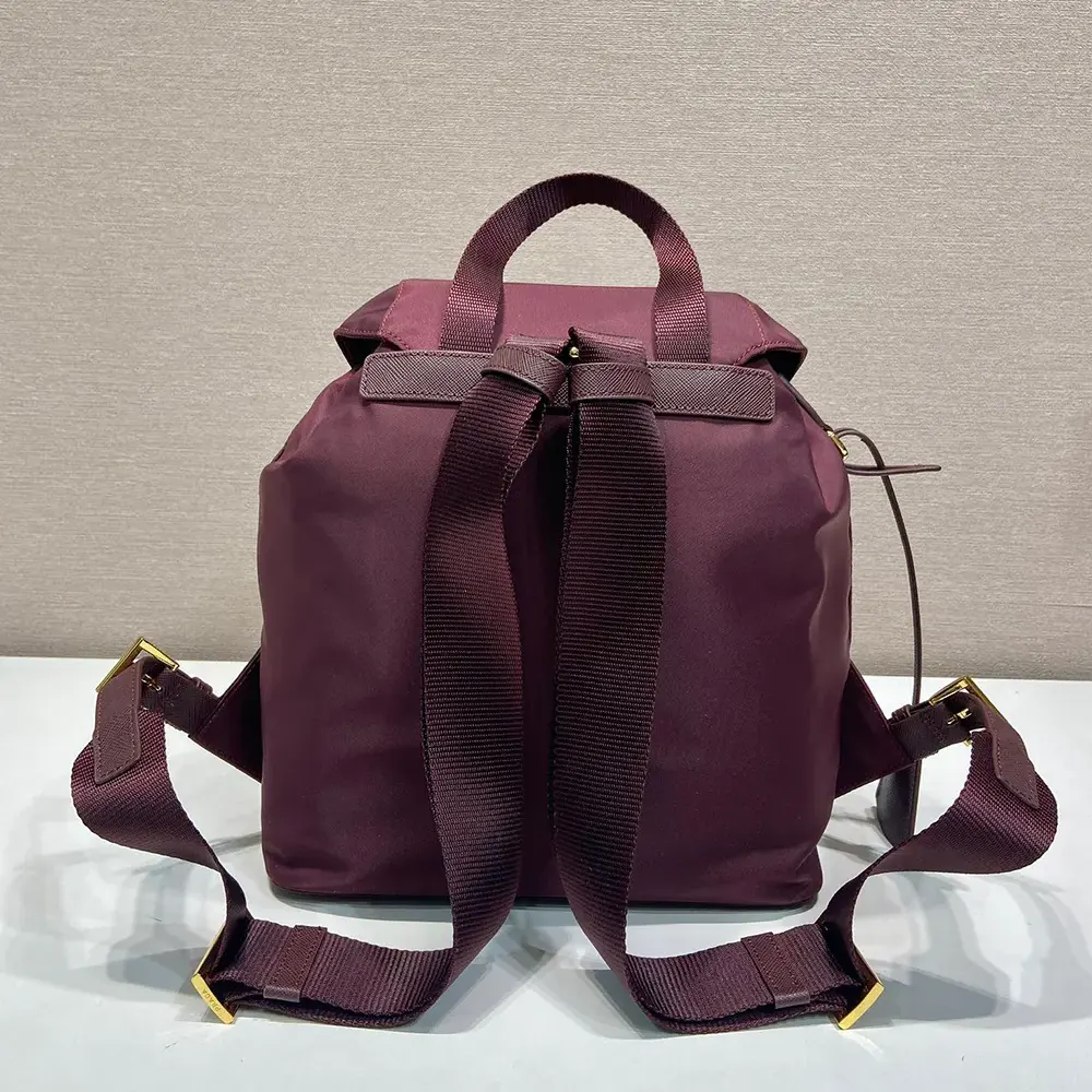 Side angle showing zipper and adjustable strap on Prada small backpack