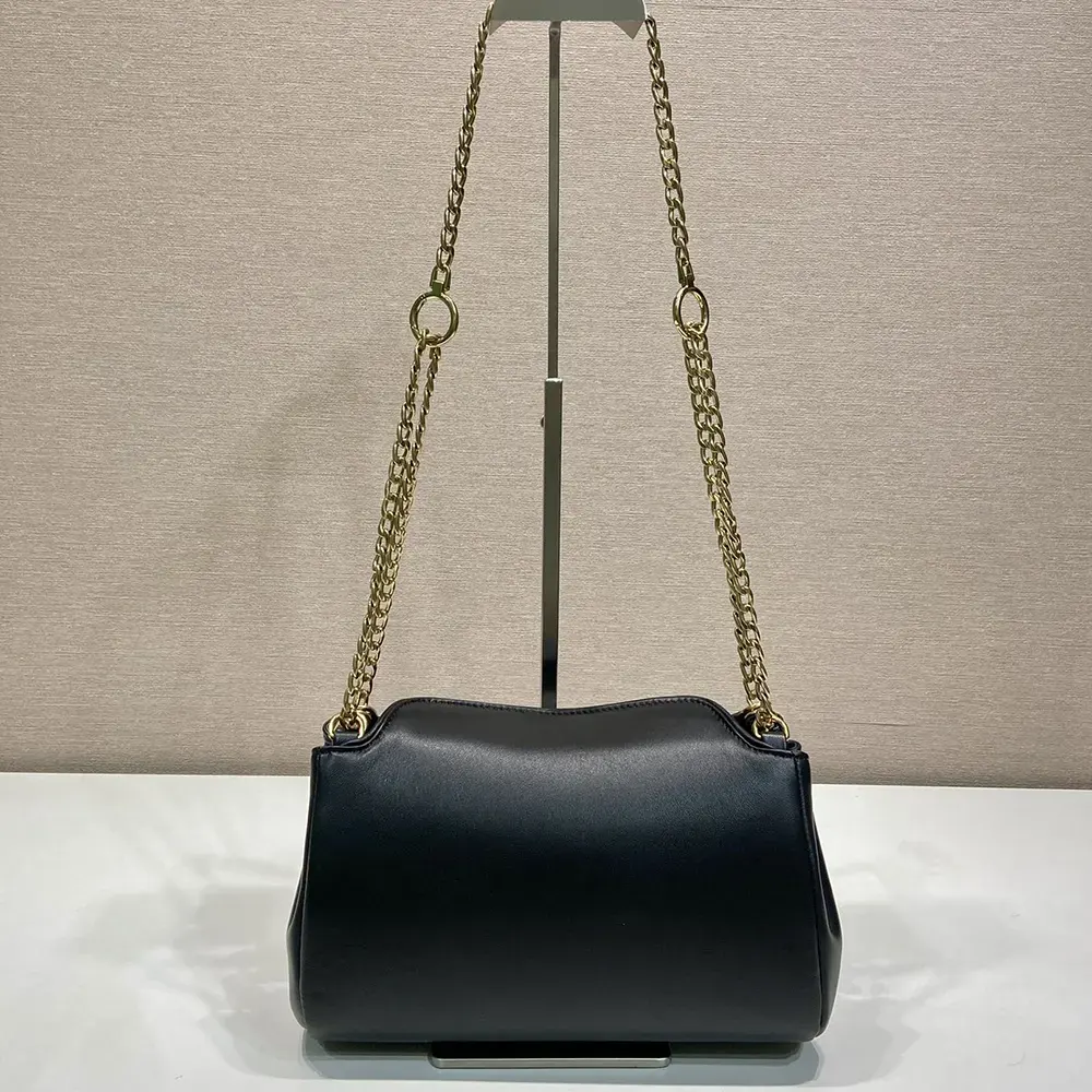 Side profile showing sleek silhouette of Prada Women Tumulte Small Nappa Leather Bag-Black