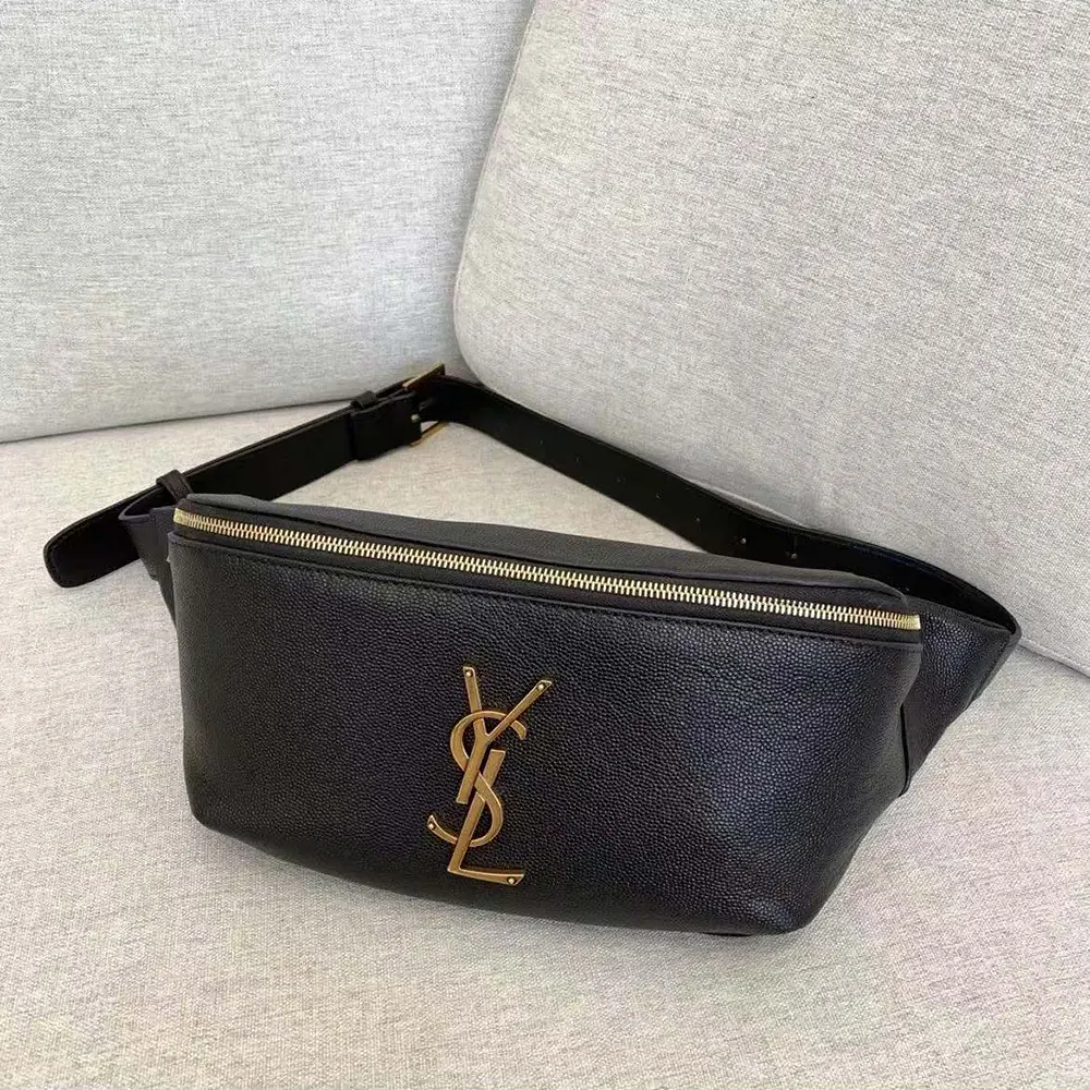 Close-up of YSL logo and silver-tone hardware on belt bag closure