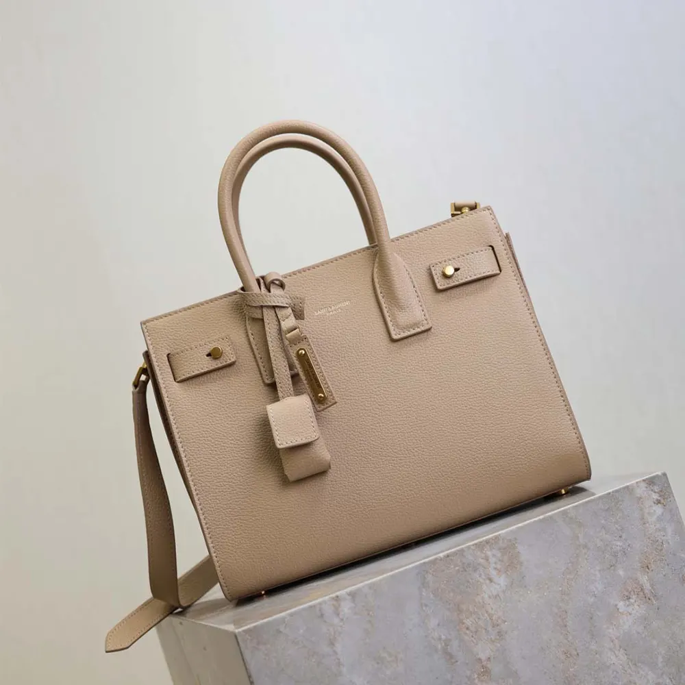 Side angle showing supple grained leather texture on Baby Sac De Jour