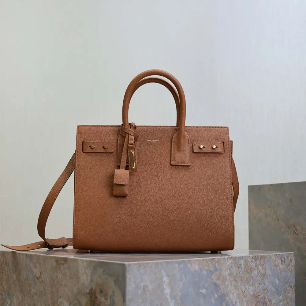 Close-up of gold hardware on Saint Laurent YSL Women Baby Sac De Jour Brown bag