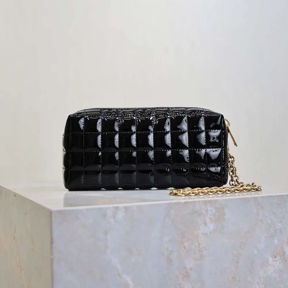 Side angle showing chain strap and magnetic closure of Saint Laurent pouch