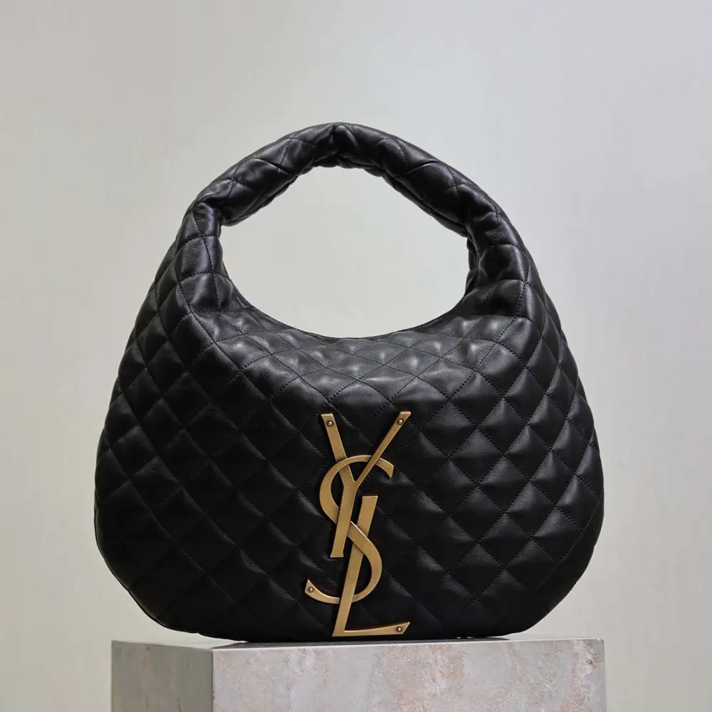 Close-up of gold YSL logo and quilted nappa leather texture