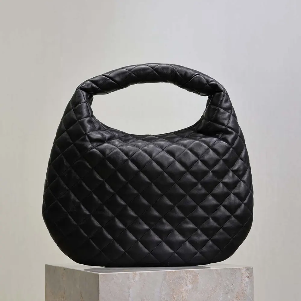Side angle showing hobo silhouette and magnetic snap closure detail
