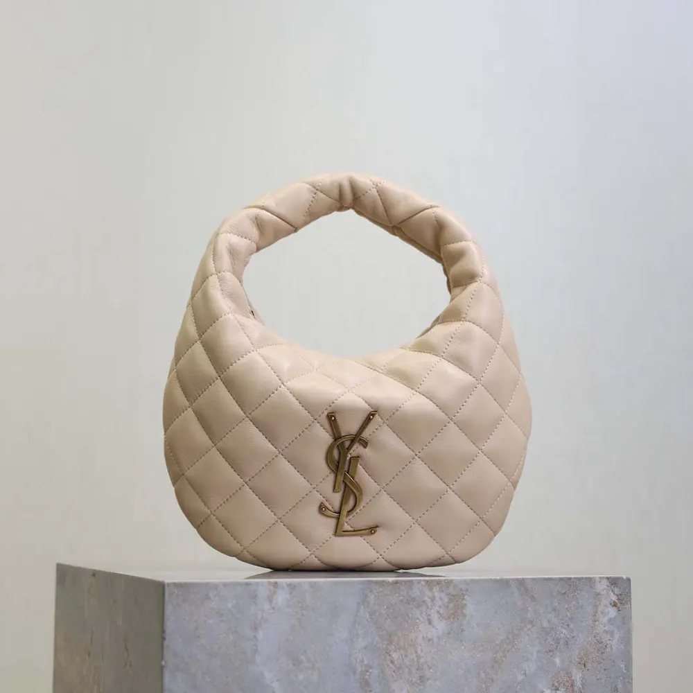 Close-up of quilted nappa leather and gold YSL hardware detail
