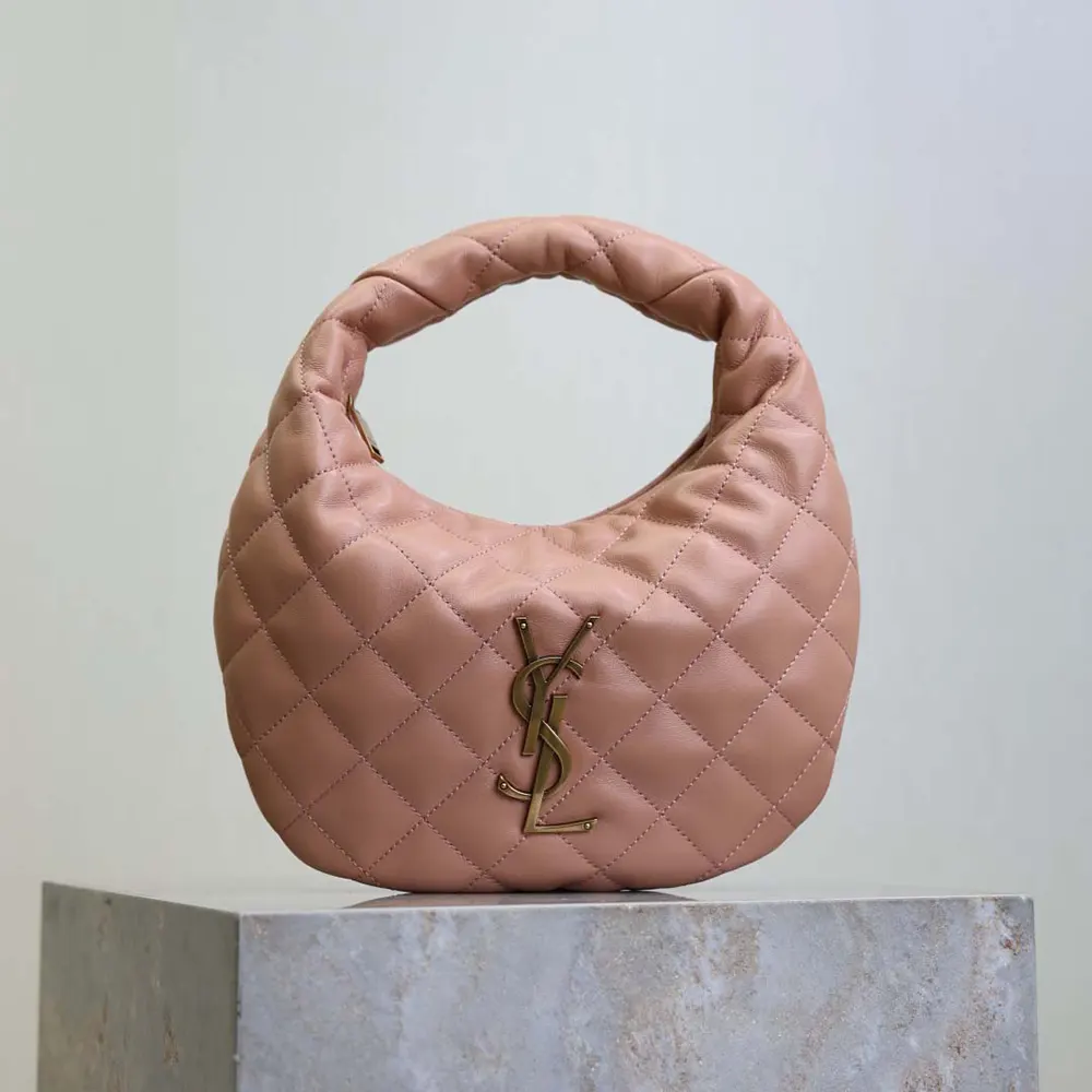 Close-up on gold YSL logo hardware on pink quilted nappa leather